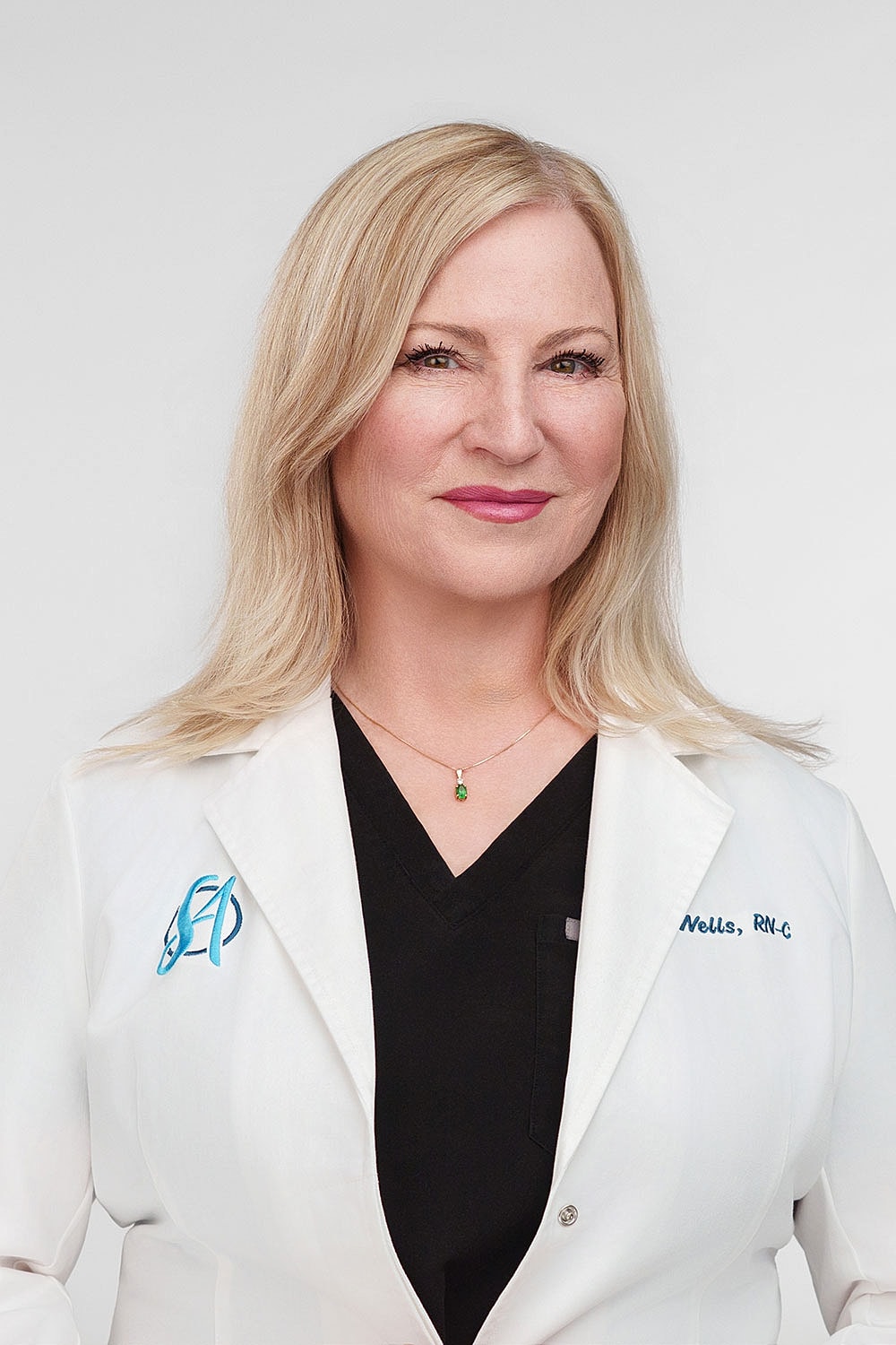 Female healthcare professional in white coat.